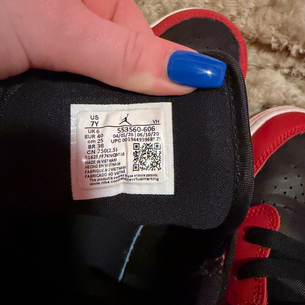 Nike Black and Red low jordan 1s